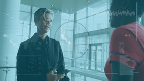 Discussing data analytics, business professionals using digital interface in office meeting. Technology, innovation, brainstorming, teamwork, data analysis, corporate - Powered by Shutterstock - Get 15% off with code: PIKWIZARD15