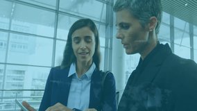 Two businesswomen discussing data processing animation over modern office background. technology, collaboration, data analysis, teamwork, innovation, leadership - Powered by Shutterstock - Get 15% off with code: PIKWIZARD15