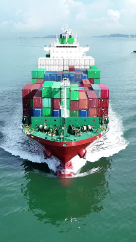 Cargo container ship carrying container and running out international container port customs shipyard sea port concept smart logistic service. Front view