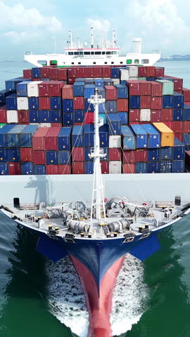 Cargo container ship carrying container and running out international container port customs shipyard sea port concept smart logistic service. Front view