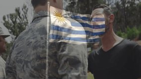 Military officer and civilian with Uruguay flag animation in outdoor setting. Ceremony, patriotism, uniform, national flag, celebration, national identity - Powered by Shutterstock - Get 15% off with code: PIKWIZARD15