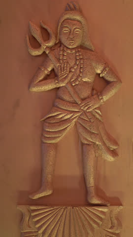 wall carved ancient statue of indian god shiva
