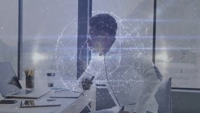 At desk, business professional creating animation with digital network globe overlay. Technology, innovation, animated, networking, futuristic - Powered by Shutterstock - Get 15% off with code: PIKWIZARD15