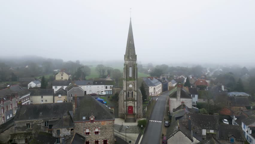 Beautiful old architecture of a church in Besle, France, birds flying, 4k