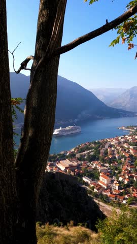 View of Adriatic Cruise ship sailing Bay of Kotor Montenegro VERTICAL shot