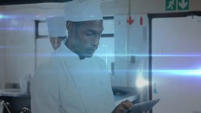 Using tablet with network animation overlay, chef planning recipes in kitchen. Culinary, cooking, technology, digital, brainstorming, gastronomy - Powered by Shutterstock - Get 15% off with code: PIKWIZARD15