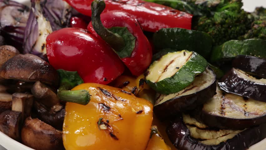 close up of grilled vegetables onion pepper mushrooms set on plate vegan bbq rotation food