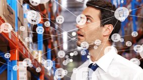In warehouse, businessman using tablet with animation of digital network icons. Technology, connectivity, innovation, logistics, management, digital transformation - Powered by Shutterstock - Get 15% off with code: PIKWIZARD15