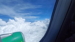 Breathtaking Aerial View of Fluffy Clouds Under a Bright Blue Sky with an Airplane Wing - Powered by Shutterstock - Get 15% off with code: PIKWIZARD15