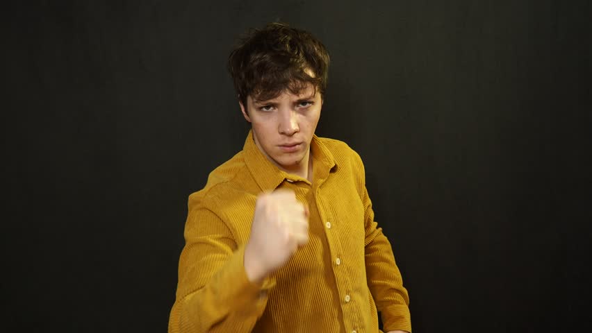 A young attractive student shows the direction.