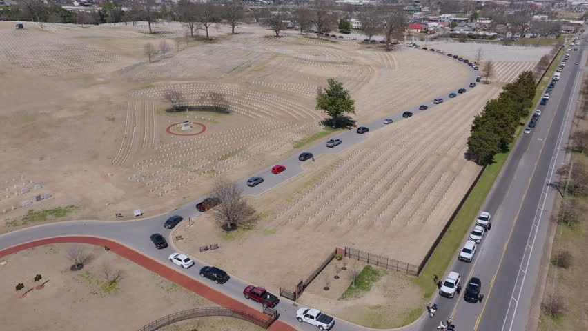 Aerial footage following a funeral procession as it moves through Chattanooga National Cemetery.