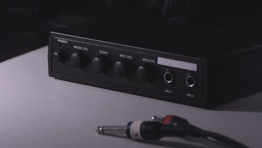 Connecting jack connector to sound device. Volume, echo, mic, simple sound effects. Karaoke set. Close-up