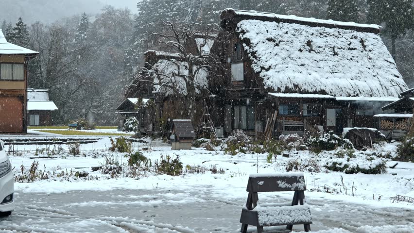 A serene snowfall blankets the UNESCO World Heritage village of Shirakawa-go, Japan.