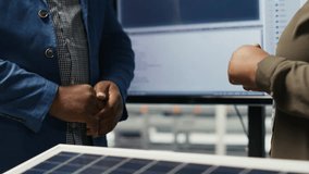 Photovoltaics factory manager meeting with investor to discuss business operations and growth plans. Solar panels plant management executive talking with shareholder, doing deal evaluation, camera B - Powered by Shutterstock - Get 15% off with code: PIKWIZARD15