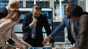 Factory management looking over schematics, working together to expand production. Industrial plant executives doing brainstorming, discussing over blueprint of facility layout, camera B - Powered by Shutterstock - Get 15% off with code: PIKWIZARD15