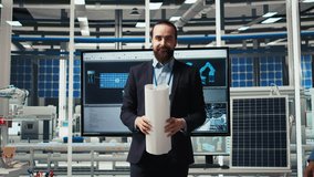 Factory management looking over schematics, working together to expand production. Industrial plant executives doing brainstorming, discussing over blueprint of facility layout, camera A - Powered by Shutterstock - Get 15% off with code: PIKWIZARD15