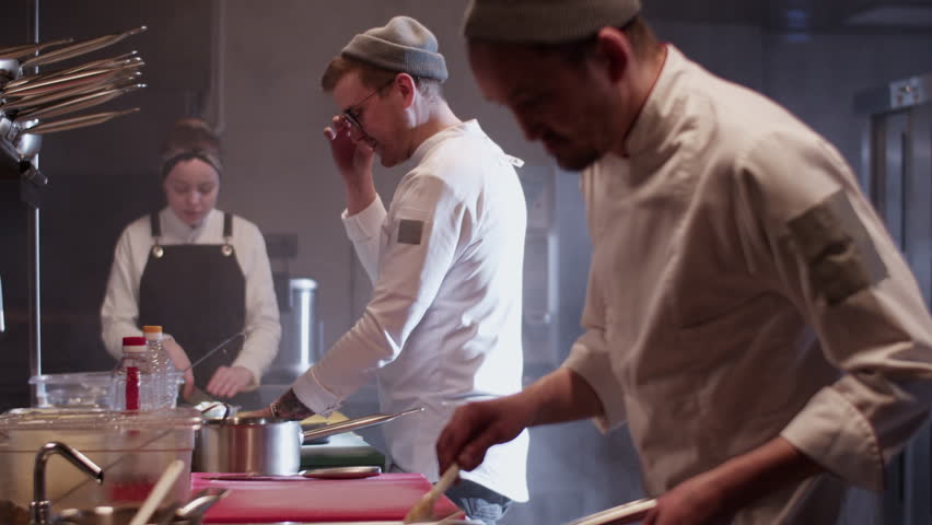 Team working together in kitchen of restaurant