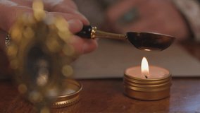 A girl heats wax and prepares a letter for mailing. wax seal. Sending a letter by mail. Hands sealing a letter with hot red wax. - Powered by Shutterstock - Get 15% off with code: PIKWIZARD15