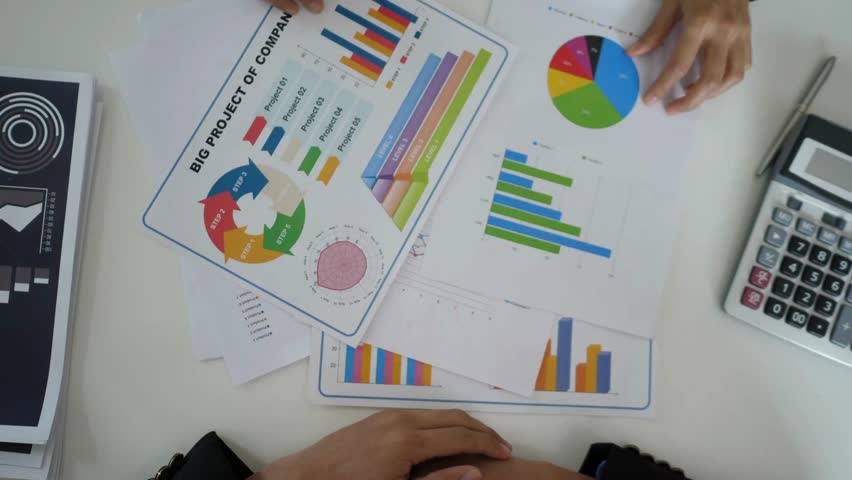 teamwork business planning concept unrecognized charts, diagrams, papers, devices. People brainstorming business planning concept work background 4K