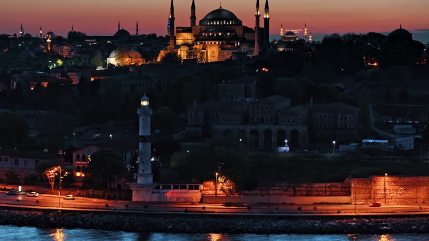 Twilight sets over Istanbul showcasing breathtaking views of historic landmarks and peaceful waterfront. Captivating blend of culture and nature unfolds under dusky sky.