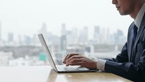Male business person using laptop computer in urban office building - Powered by Shutterstock - Get 15% off with code: PIKWIZARD15
