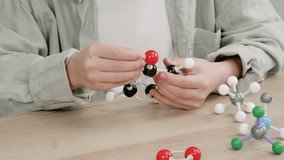 Close-Up of Hands Assembling a Molecular Model – Science Education and Chemistry Learning

 - Powered by Shutterstock - Get 15% off with code: PIKWIZARD15