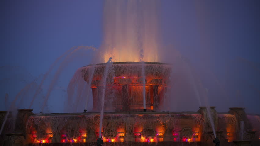 Buckingham Fountain illuminated at night in downtown Chicago, Illinois. Close up
