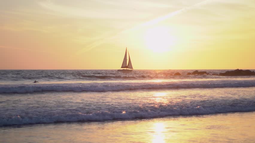 Sailboat at Sunset on Ocean Horizon California Coastline