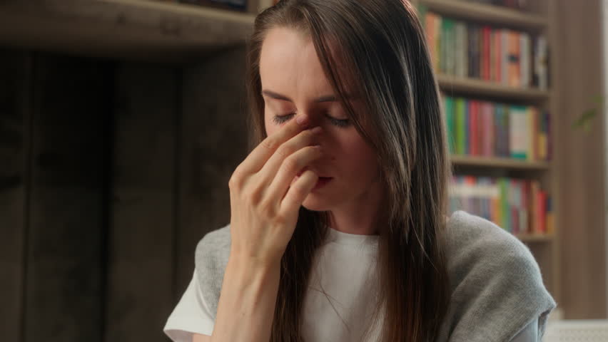 Caucasian tired woman take off glasses female overworked student stress school worker library health problem headache migraine head eyes strain businesswoman indoor business girl sad painful teacher