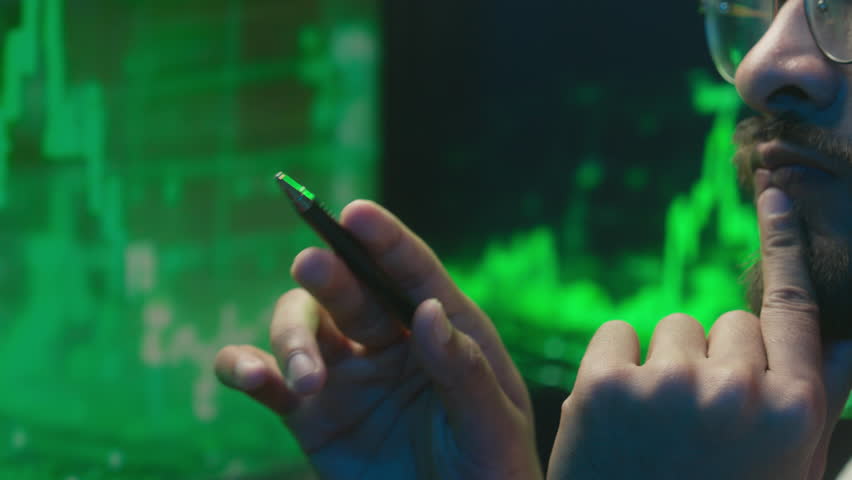 Arabian Indian man analyst programmer holding pen pointing coder hacker work planning male pondering thinking imagination businessman calculating contemplation strategy guy inspiration solve business