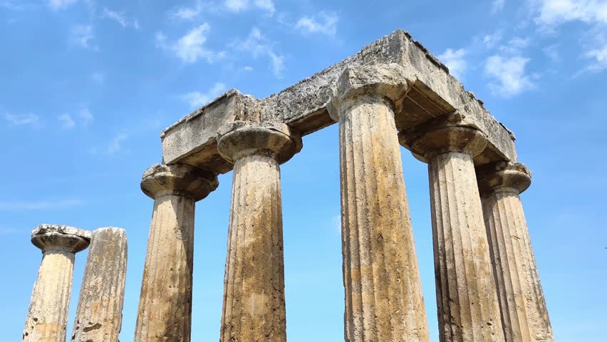 Closeup view of the Temple of Apollo in ancient Corinth, Greece. Built in the 7th century BC, it is among the earliest Doric temples, showcasing ancient Greek architecture and historical significance.