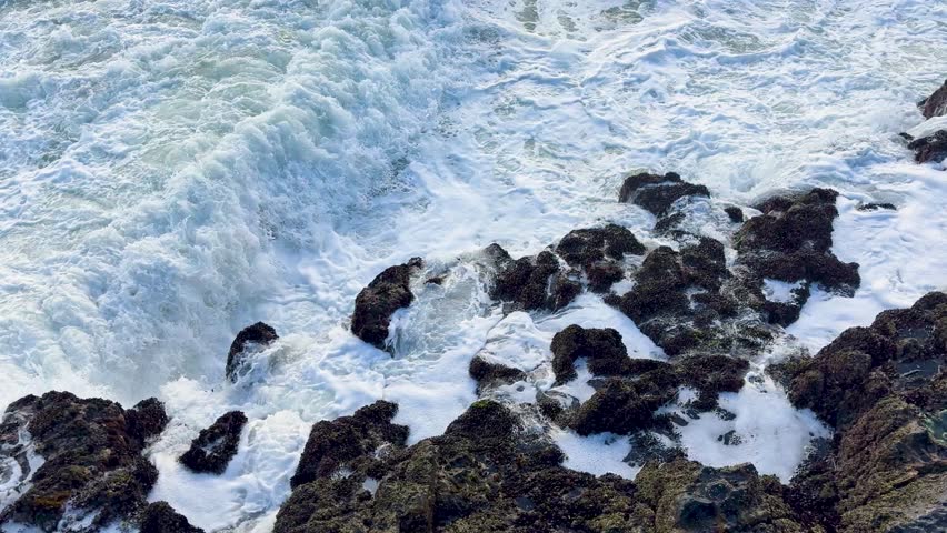 Dramatic Ocean Waves Crashing on Rocky Shore