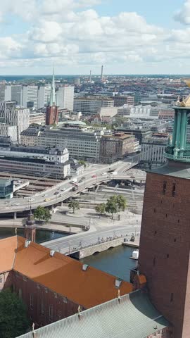 Vertical video. Stockholm, Sweden. Stockholm City Hall and Lake Malaren. Panorama of the city. Summer day, Aerial View, Departure of the camera