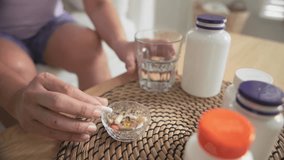 Asia adult aged people middle age happy old woman smile drink vitamin d c e k zinc omega 3 fish oil water pill reduce hot flash dry skin health care sit at home sofa elder aging asian. Take diet food. - Powered by Shutterstock - Get 15% off with code: PIKWIZARD15