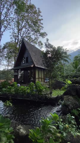 Small cabin house with small pond located at an organic farm in west java Indonesia