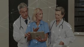 Doctors discussing patient data on tablet with network connections animation overlay. Healthcare, technology, collaboration, digital, innovation, communication - Powered by Shutterstock - Get 15% off with code: PIKWIZARD15