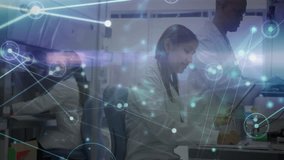 In lab, scientists analyzing digital network connections with animation overlay. Technology, innovation, research, data analysis, laboratory, connectivity - Powered by Shutterstock - Get 15% off with code: PIKWIZARD15