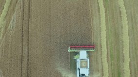 Combine harvester working in wheat field with data analytics animation overlay. Agriculture, farming, technology, innovation, machinery, rural - Powered by Shutterstock - Get 15% off with code: PIKWIZARD15