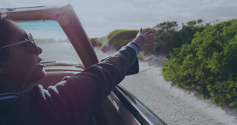 Person in car enjoying scenic drive with speedometer animation overlay. Commuting, driving, journey, automobile, technology