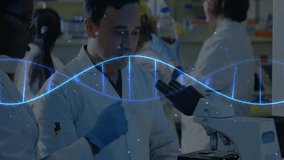 Scientists in lab coats examining microscope with DNA strand animation overlay. Science, research, laboratory, biotechnology, genetics, healthcare - Powered by Shutterstock - Get 15% off with code: PIKWIZARD15