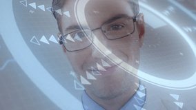 Smiling man with glasses interacting with animation on futuristic digital interface. Technology, innovation, touchscreen, virtual, augmented reality, creativity - Powered by Shutterstock - Get 15% off with code: PIKWIZARD15