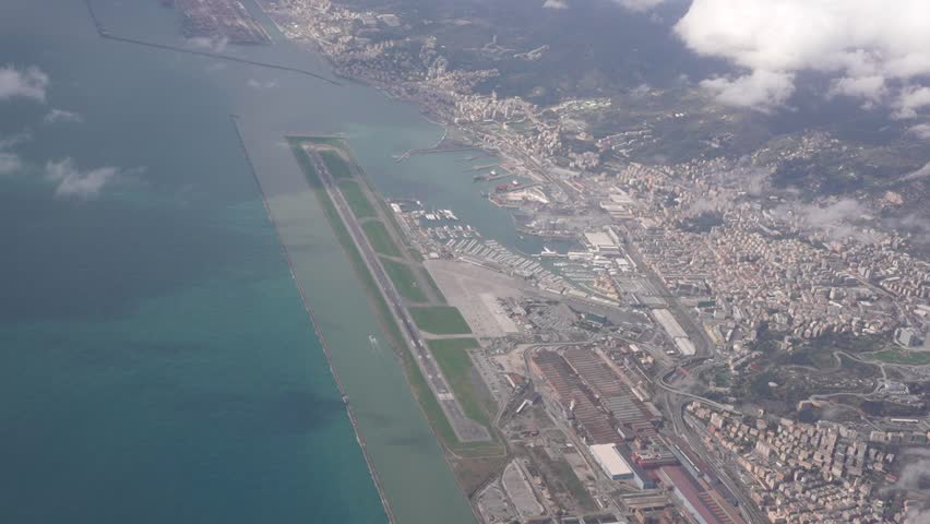 Landing in Genoa by the sea airport slow motion