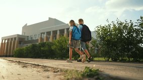 Happy family concept. portrait of children going to school. children with backpacks run on way to school. students go together to receive an education. children's dream. students smiling holding hands - Powered by Shutterstock - Get 15% off with code: PIKWIZARD15