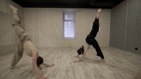 Group of teenage girls doing warm-up exercises before dancing in studio. Hobby concept. - Powered by Shutterstock - Get 15% off with code: PIKWIZARD15