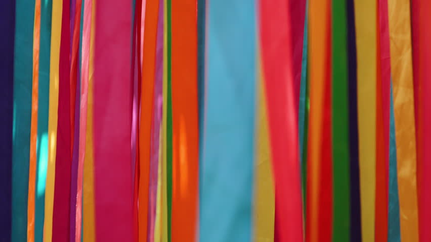Horizontal background of moving bright multi-colored ribbons, close-up. Abstract festive background of carnival celebration. - Powered by Shutterstock - Get 15% off with code: PIKWIZARD15