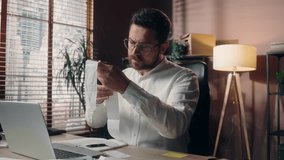 Worried Caucasian manager man entrepreneur salesman employee holding bill in office businessman male reading financial expenses middle-aged worker guy money loss problem business anxiety bankruptcy - Powered by Shutterstock - Get 15% off with code: PIKWIZARD15