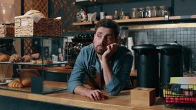 Frustrated Caucasian bartender man staff guy waiting clients in coffee shop bored employer working small business owner feeling stress cafeteria upset male barista no customers problem cafe difficulty - Powered by Shutterstock - Get 15% off with code: PIKWIZARD15