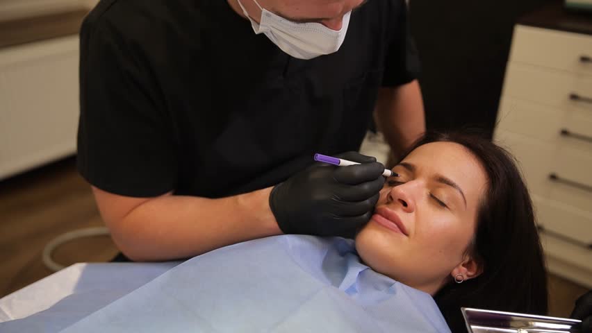 Plastic surgeon, working on face for changes, cosmetics and beauty with medical care. Doctor examines patient - Powered by Shutterstock - Get 15% off with code: PIKWIZARD15