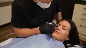 Plastic surgeon, working on face for changes, cosmetics and beauty with medical care. Doctor examines patient - Powered by Shutterstock - Get 15% off with code: PIKWIZARD15