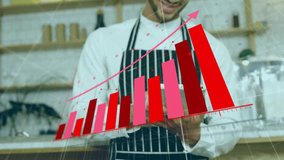 Barista in apron using tablet with red bar graph animation overlay. technology, café, analytics, digital, business, data - Powered by Shutterstock - Get 15% off with code: PIKWIZARD15